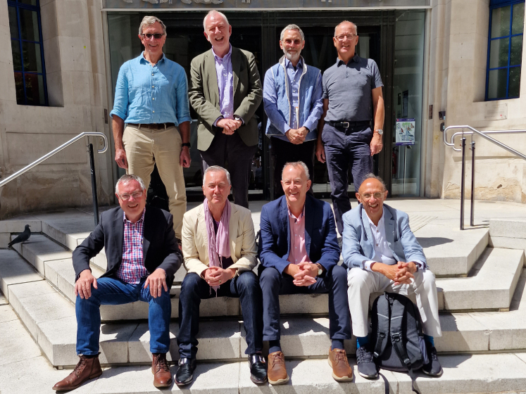 A recent image of Peter Whitehead and his friends in front of the Old Building entrance
