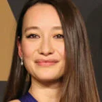 Joanna is smiling at the camera.