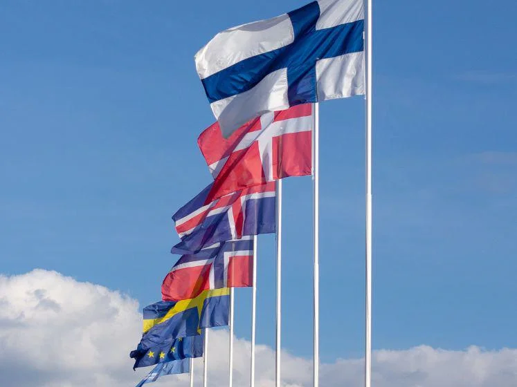 A series of raised flags from European countries.