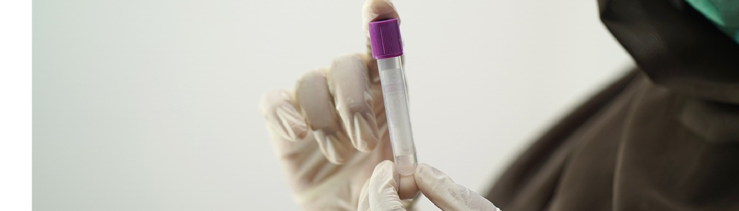 Someone holding a test tube