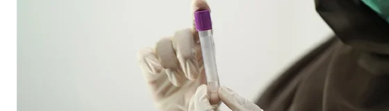 Someone holding a test tube