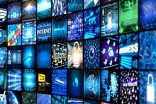 Wall of TV screens curving away