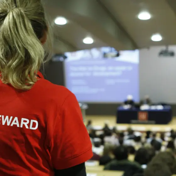 LSE Events steward in a full Sheikh Zayed Theatre