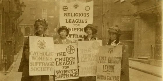 A group of women with placards.