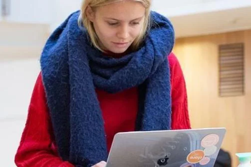female-student-studying-laptop-scarf-EGI-header-1400x300