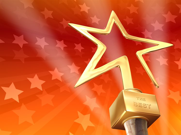 Gold star trophy on orange starred background