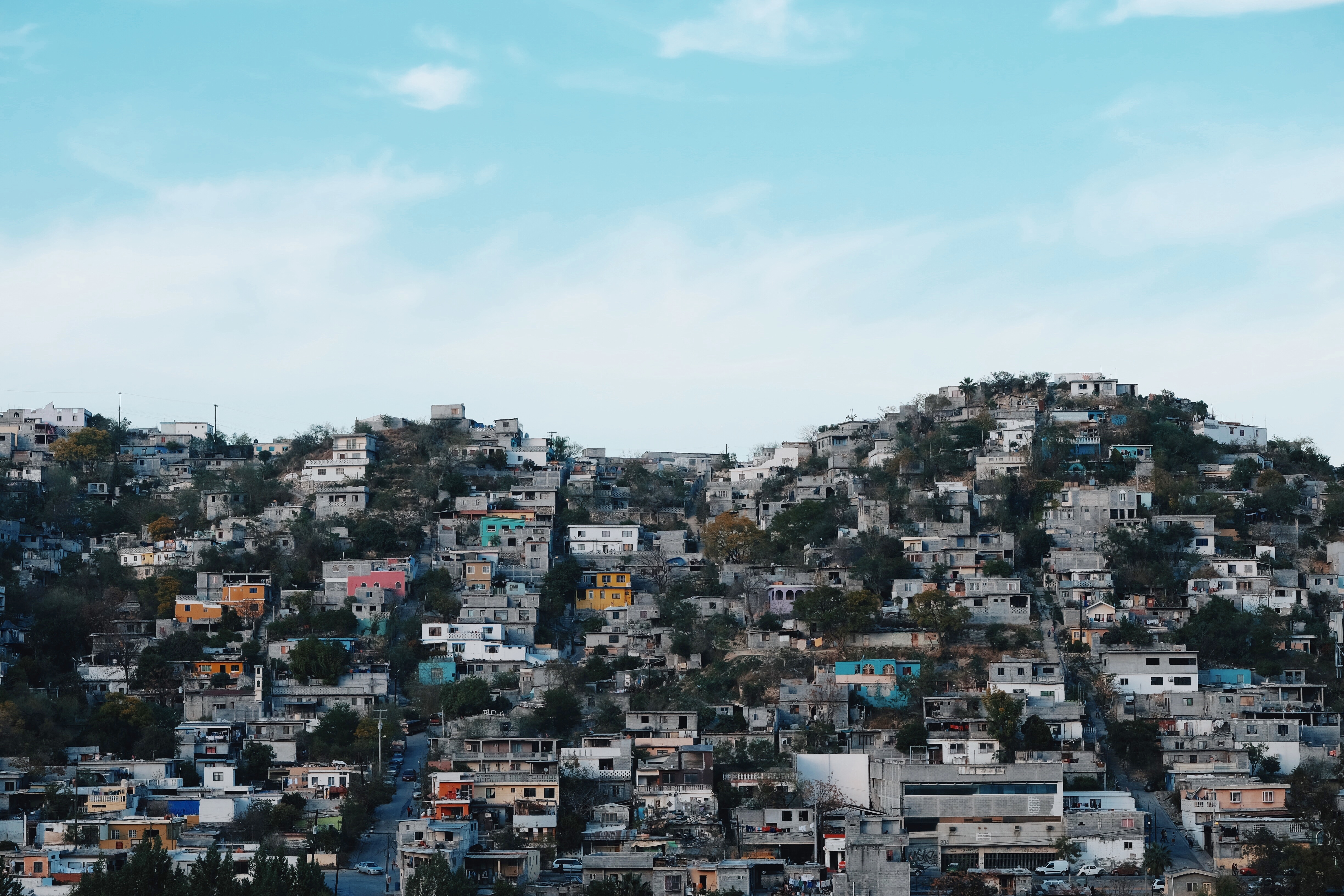 dense, low-quality housing on a hill
