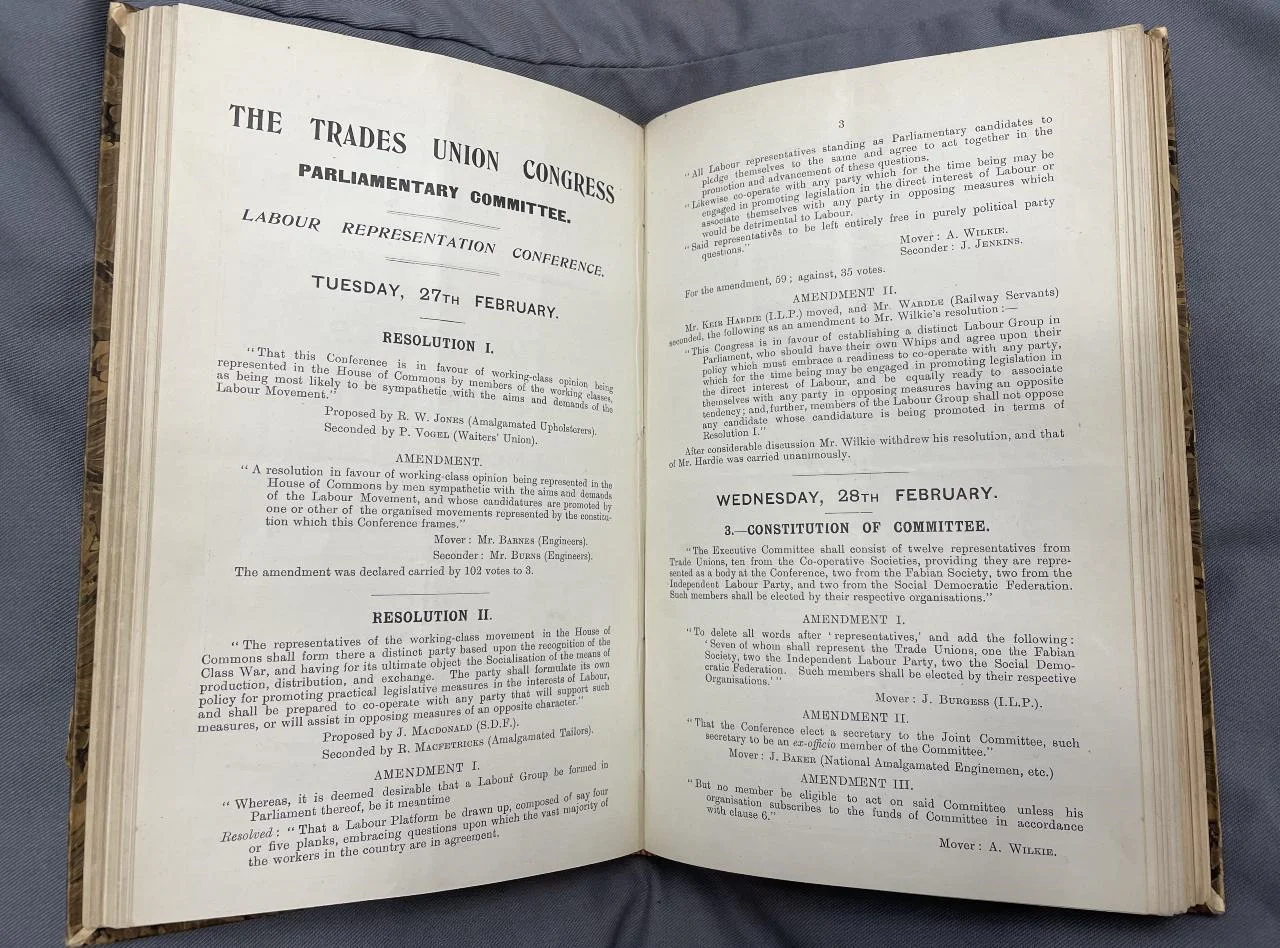 A Trades Union Congress conference programme open to show a set of resolutions.