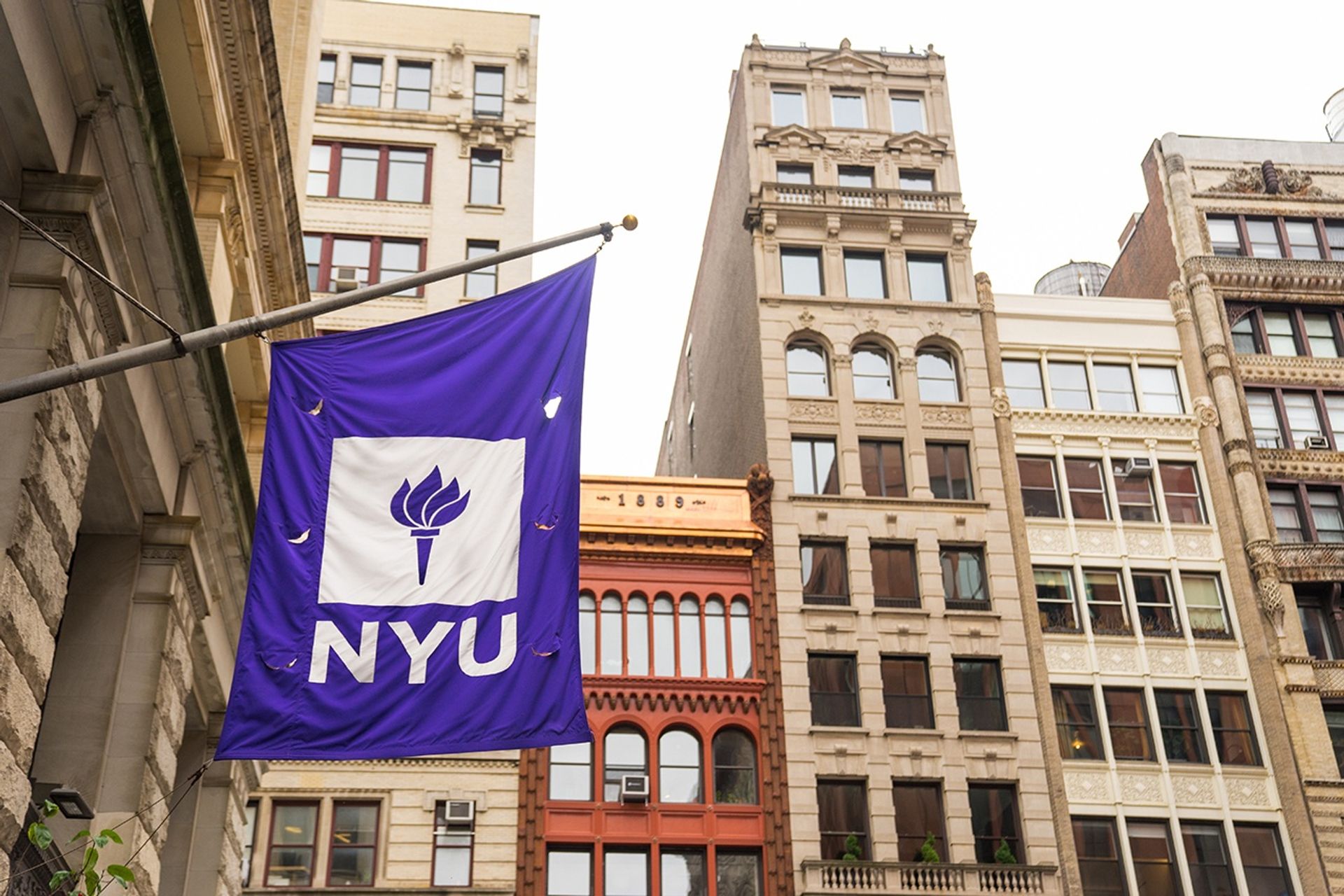 NYU banner hanging off building in New York City