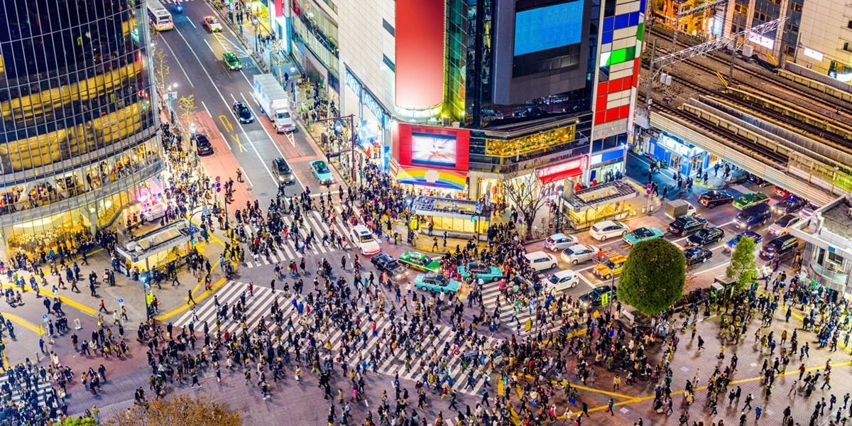 A busy Shibuya crossing at night