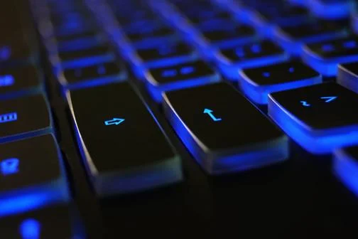 image of keyboard back lit with a blue light