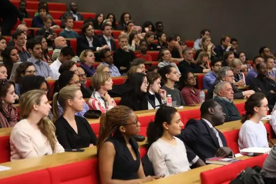 Audience watching a public lecture.