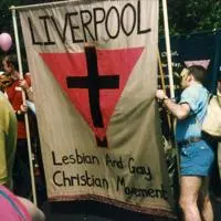 People at a march holding a banner