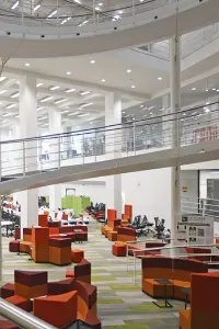 The stairs in the Library from the ground floor going upwards.