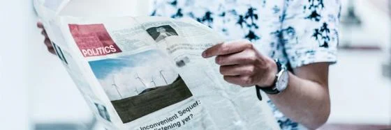 stock image of someone reading a newspaper