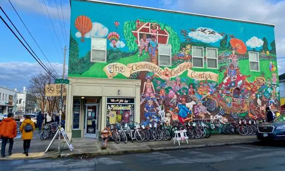 A cycle shop in Oregon, USA with colourful artwork on the wall