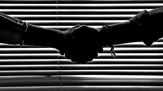 two people shaking hands