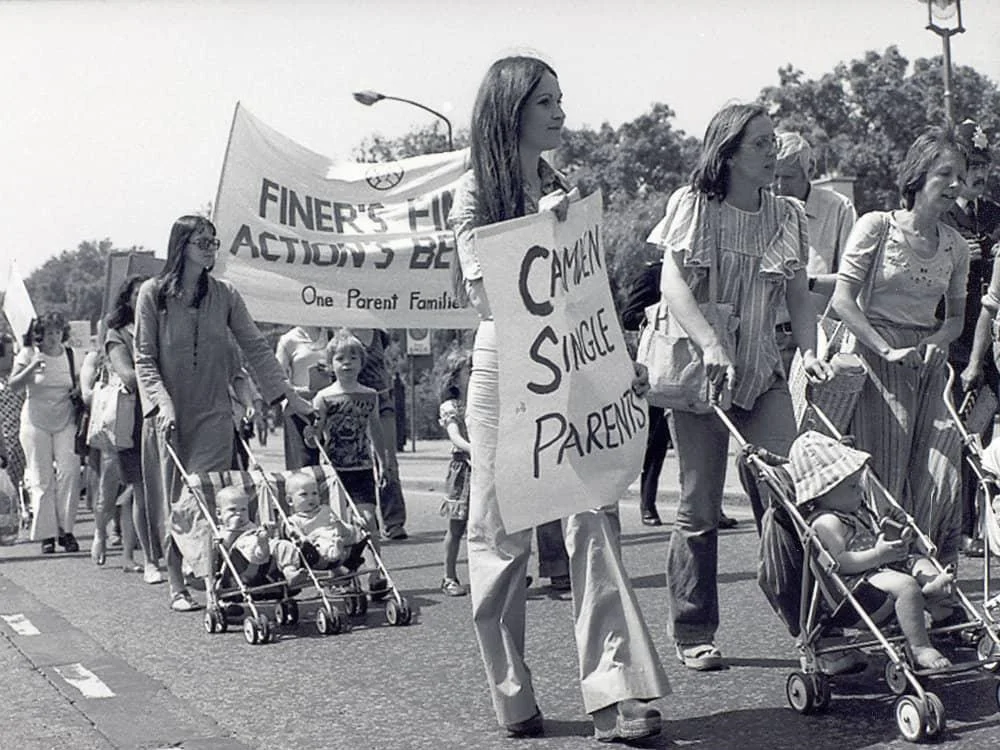 Single parents' marching along a street
