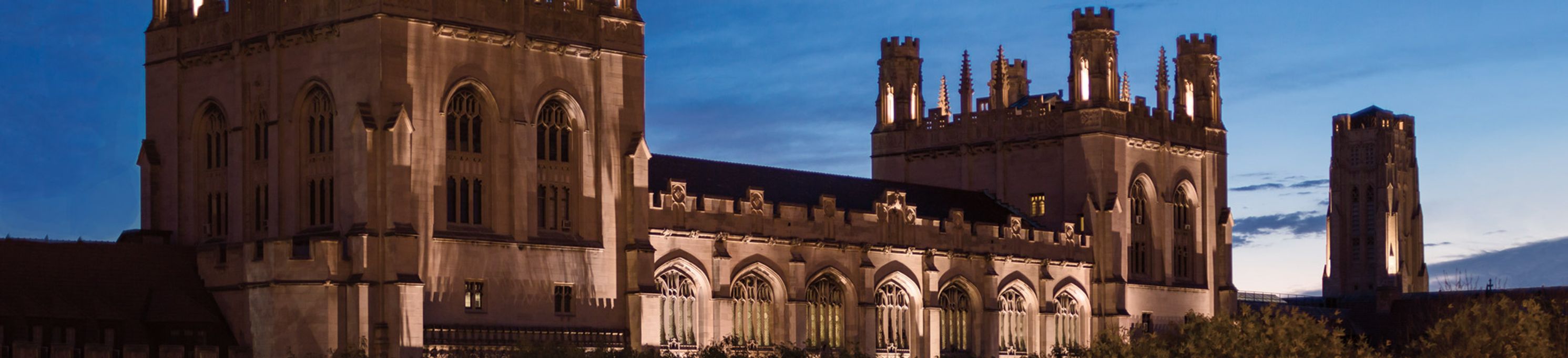 University of Chicago main building illuminated by spotlights at sunrise