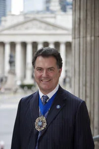 Vincent Keaveny headshot with Badge and TLMA