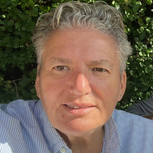 Image of woman (Wanda Goldwag) against greenery