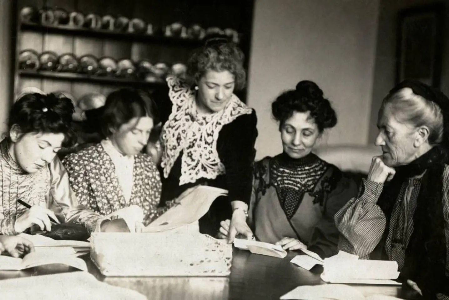 Members of the Women's Social and Political Union gathered at a table.