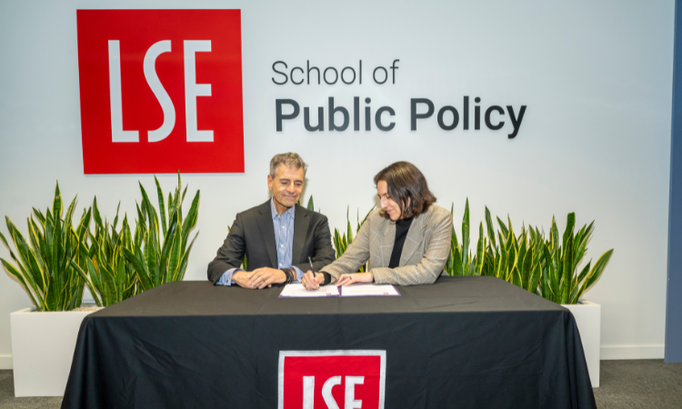 Isabella Luksic signing the scholarship renewal agreement