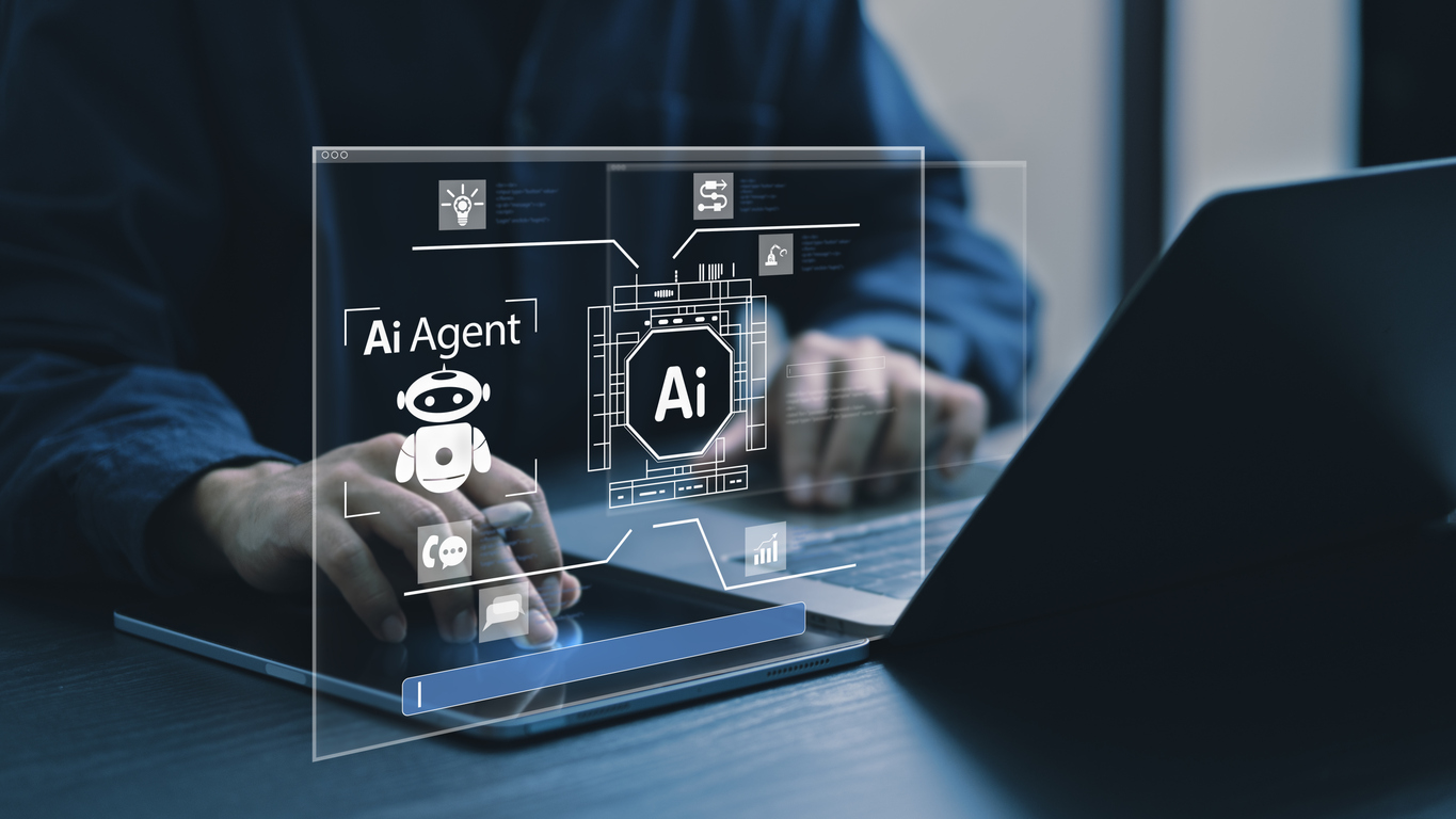 A person working on their laptop with an illustration of an AI agent.