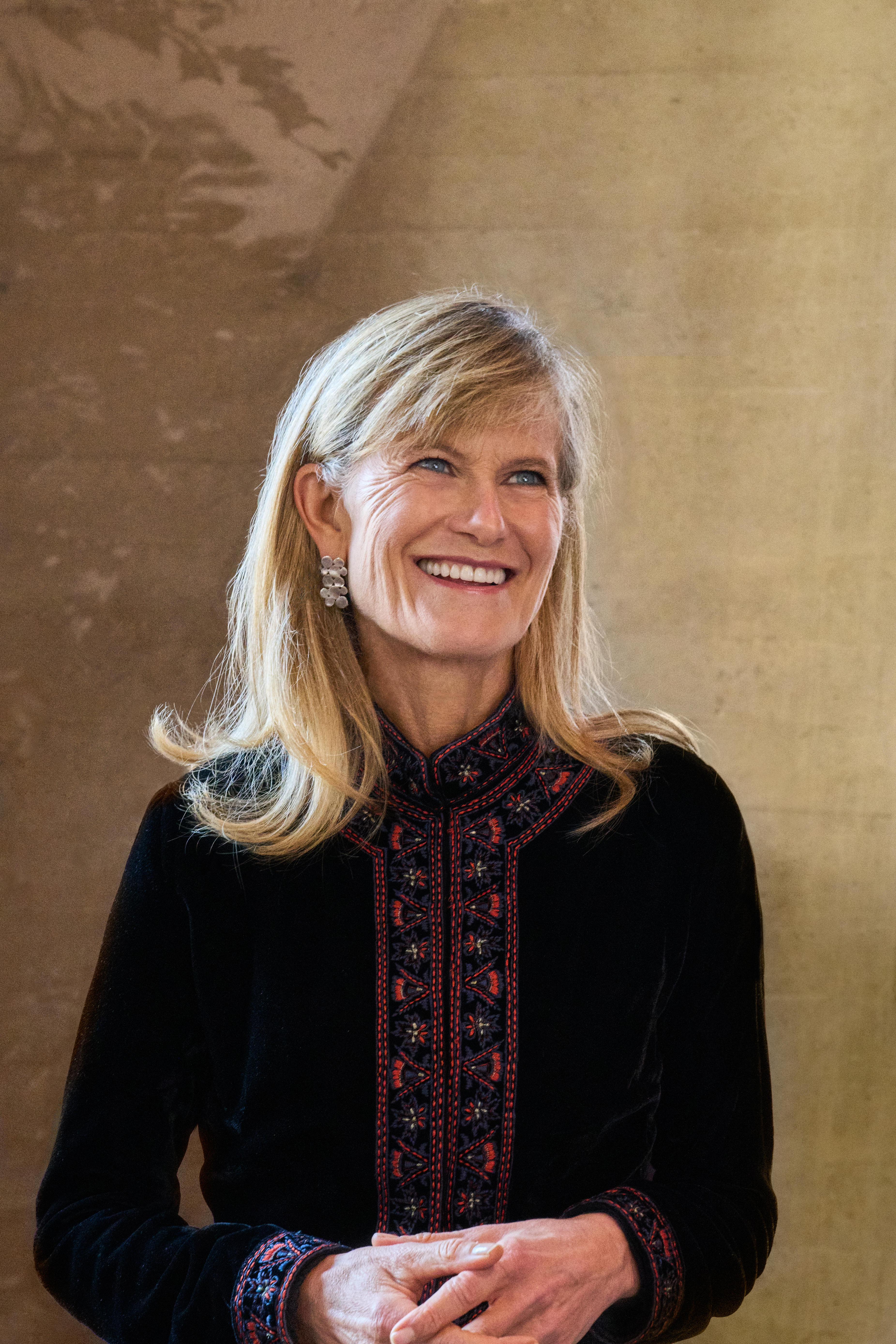 Jacqueline wearing a patterned black top