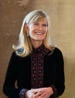 Jacqueline wearing a patterned black top