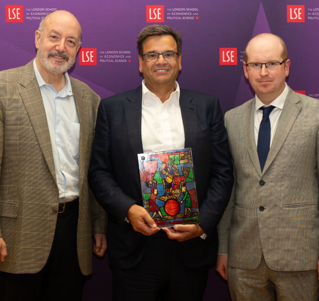 Jeremy Coller holding Fabian Window plaque flanked by Larry Kramer and Jonathan Birch