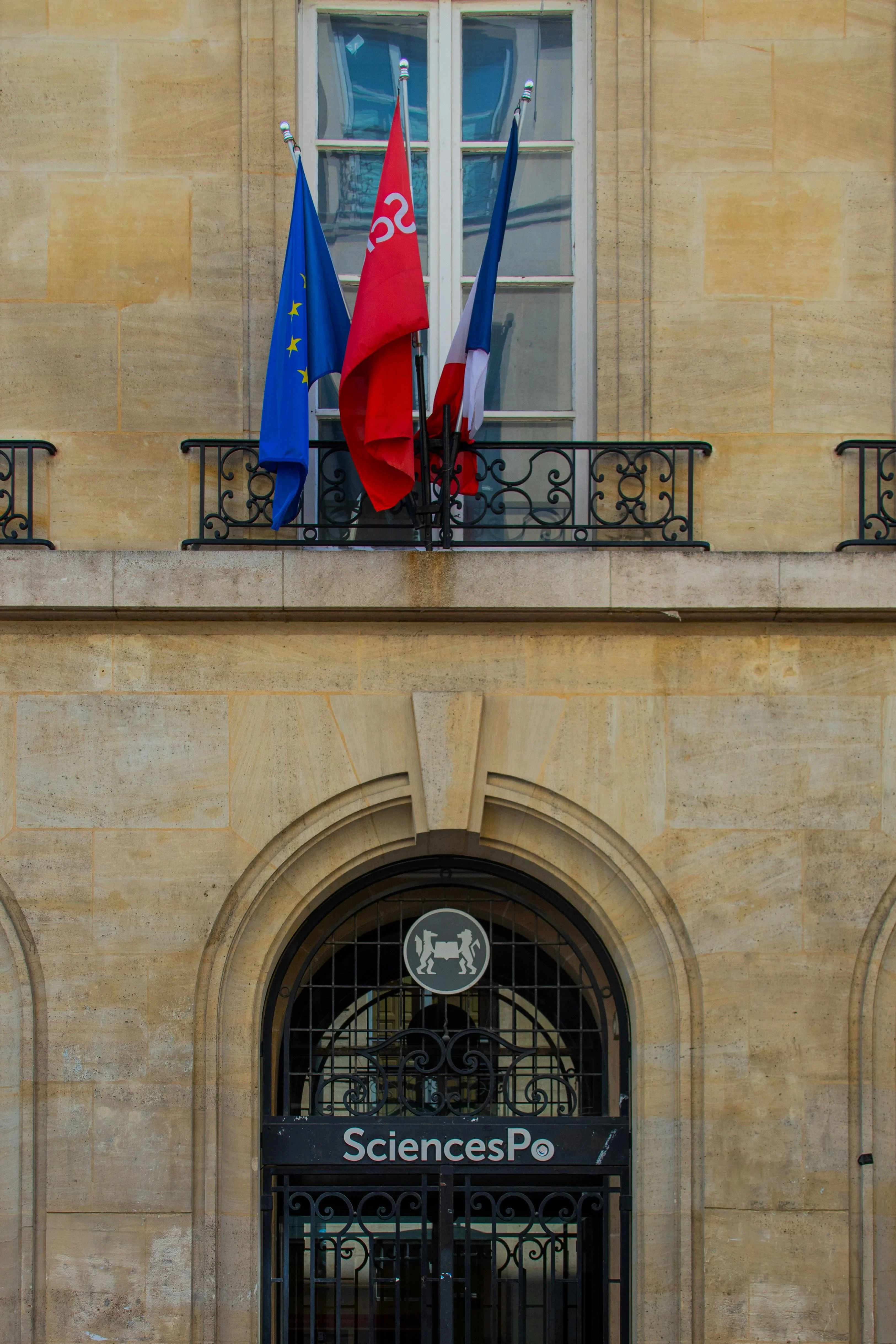 The EU, Sciences Po and French flag hanging from a Sciences Po campus building.