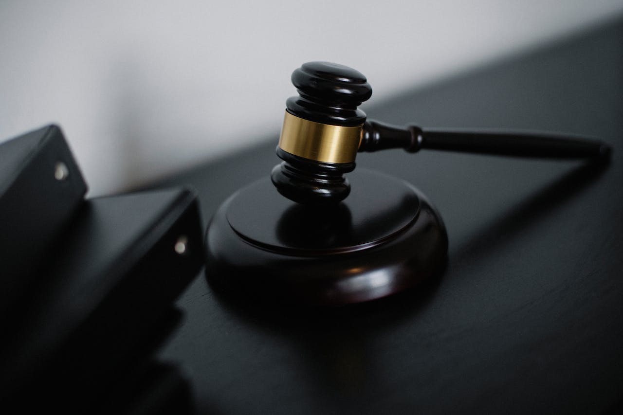 Judge’s gavel resting on a wooden sound block