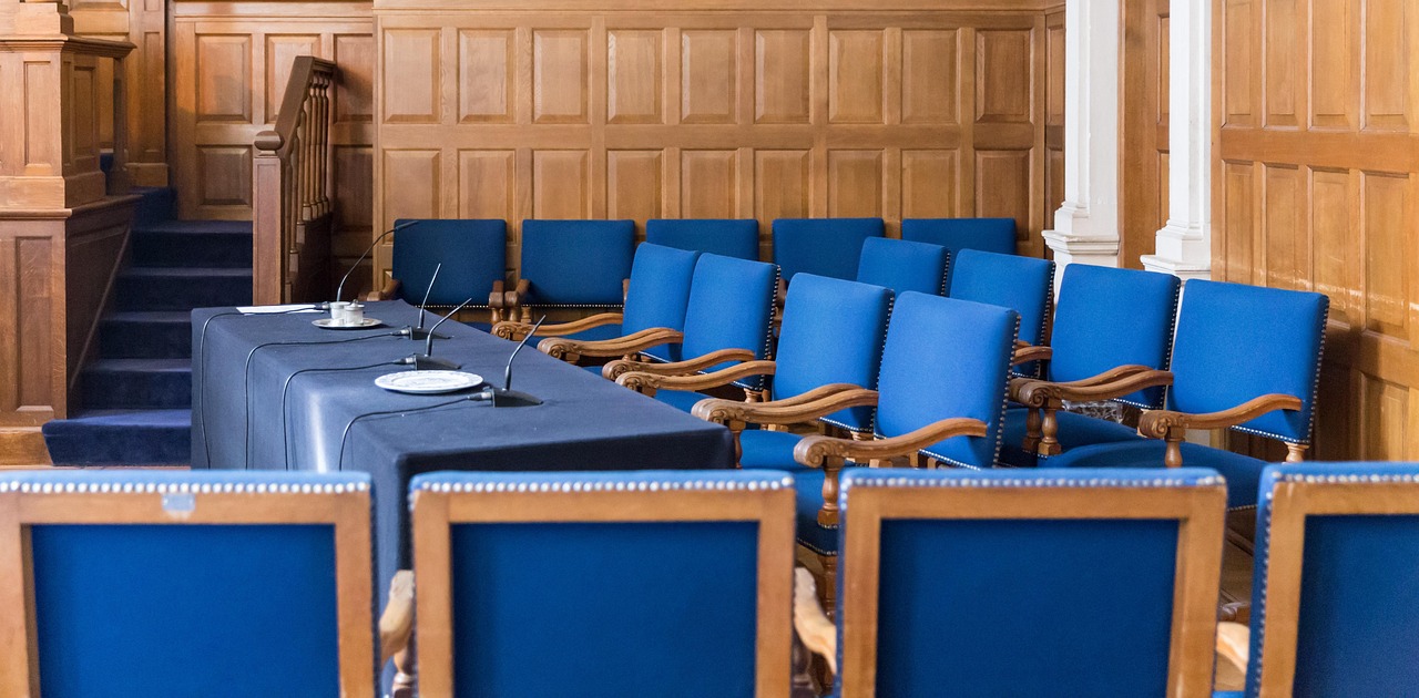 empty courtroom with chairs and microphones