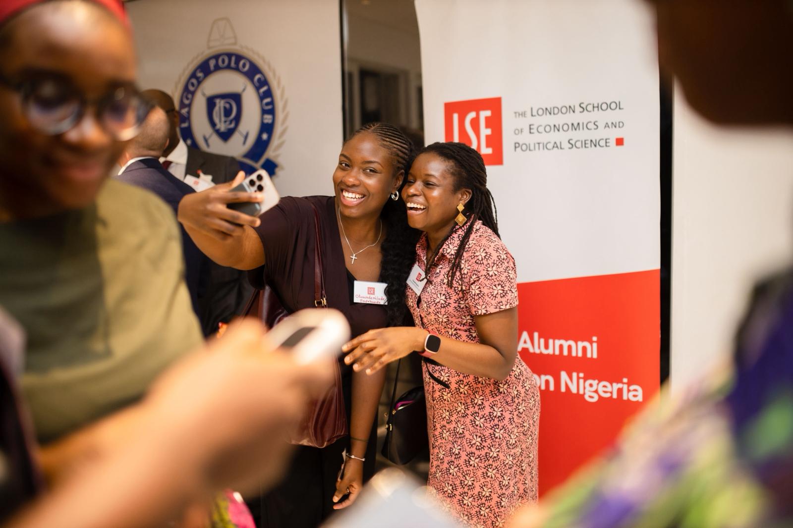 Two alumnae take a selfie during our event in Lagos
