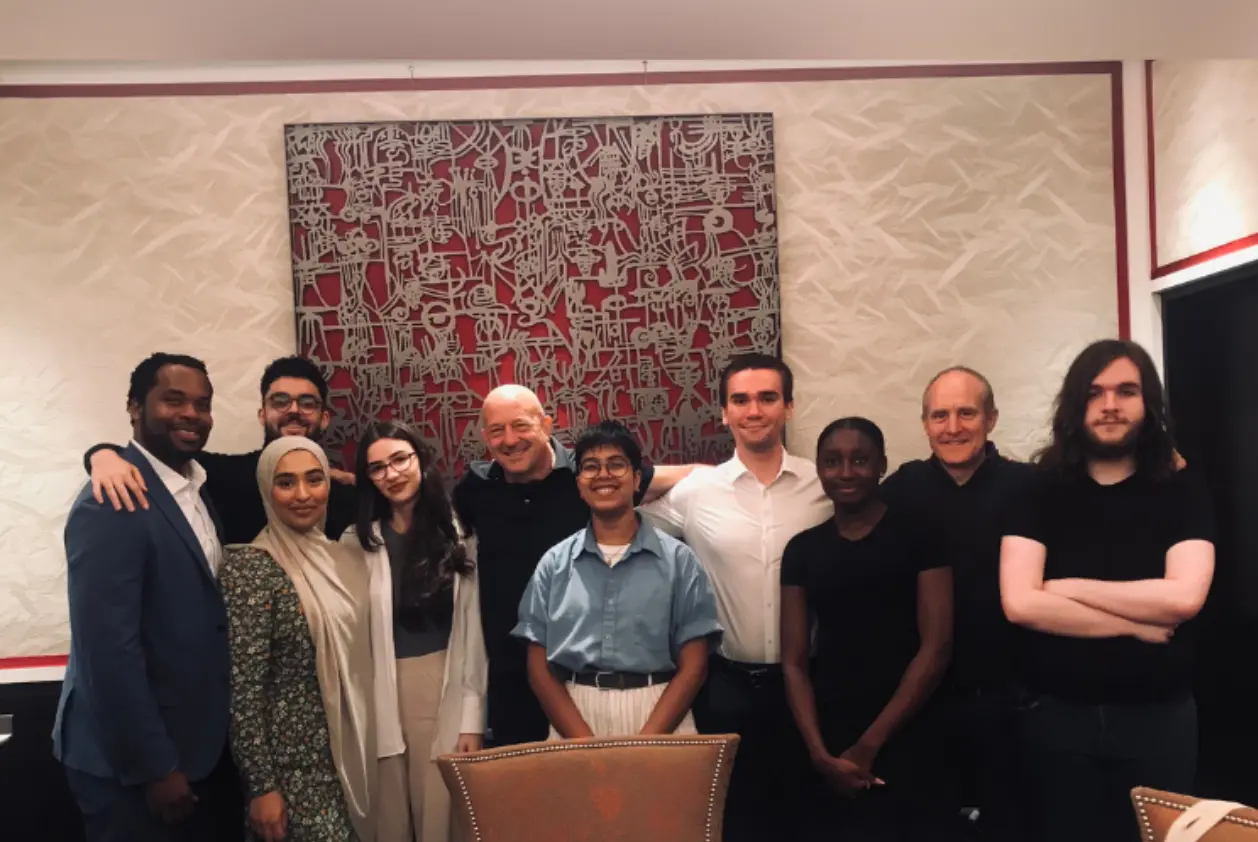 Uggla Family Scholars stand behind a table