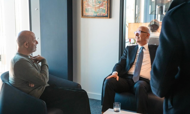 Professor Larry Kramer on the left talking to Minister Roland Lescure 