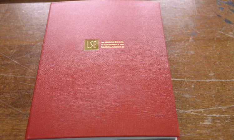 Red book cover with LSE in gold