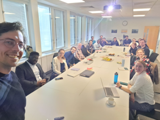Researchers around a table meeting at LSE working on South Africa project