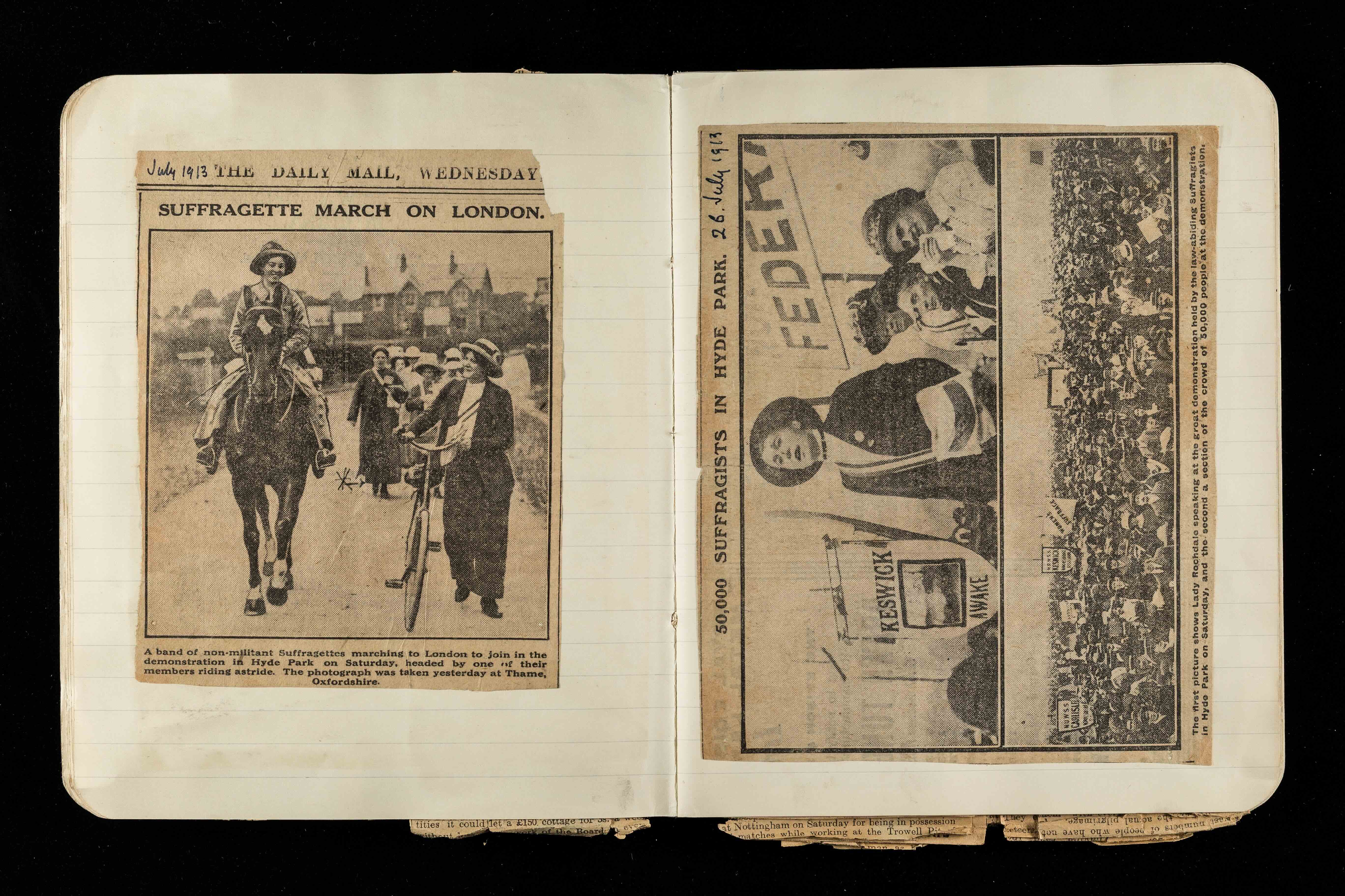Newspaper cuttings about a suffrage march. In a diary.