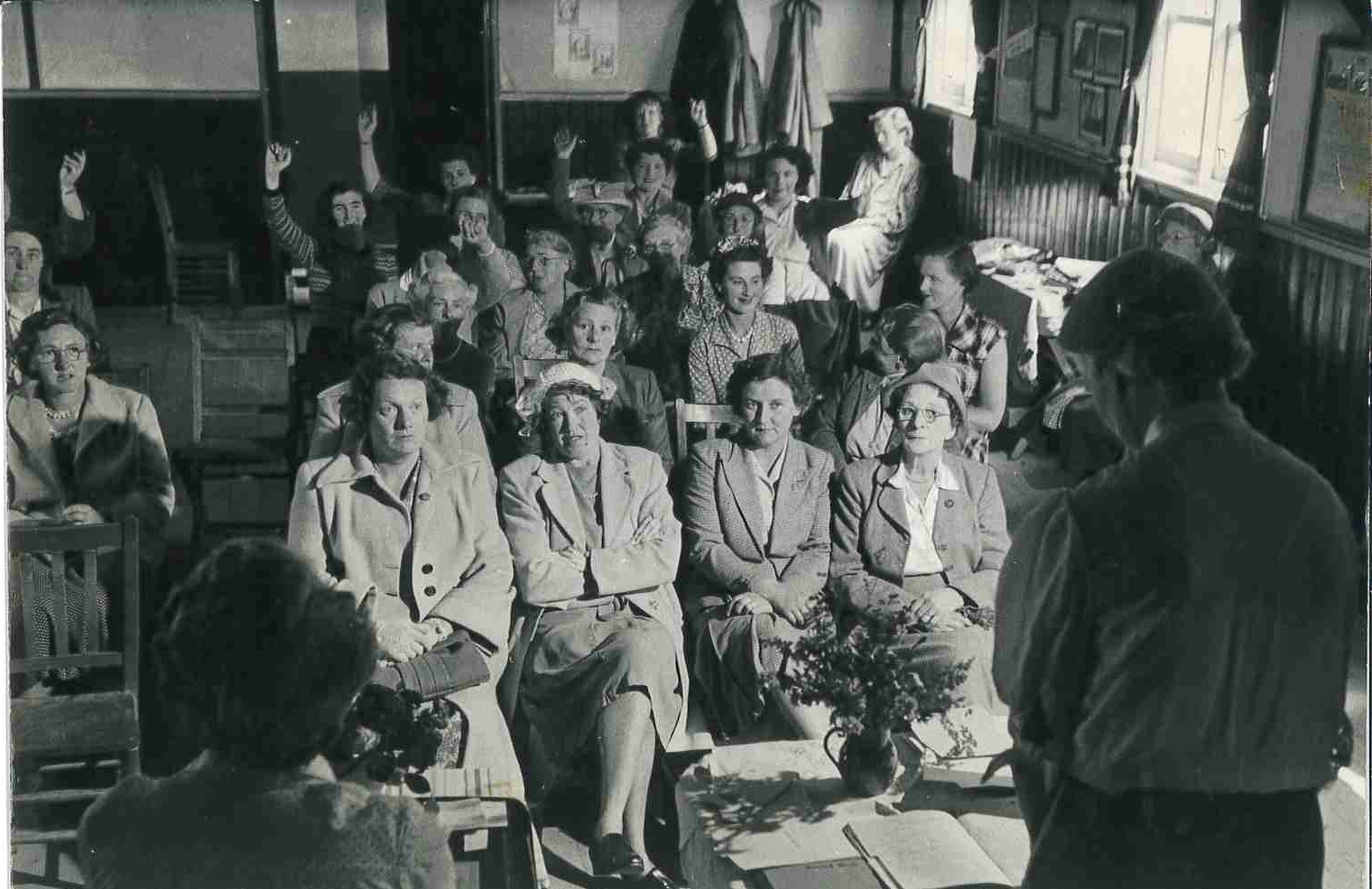 A group of women seated listening to a talk