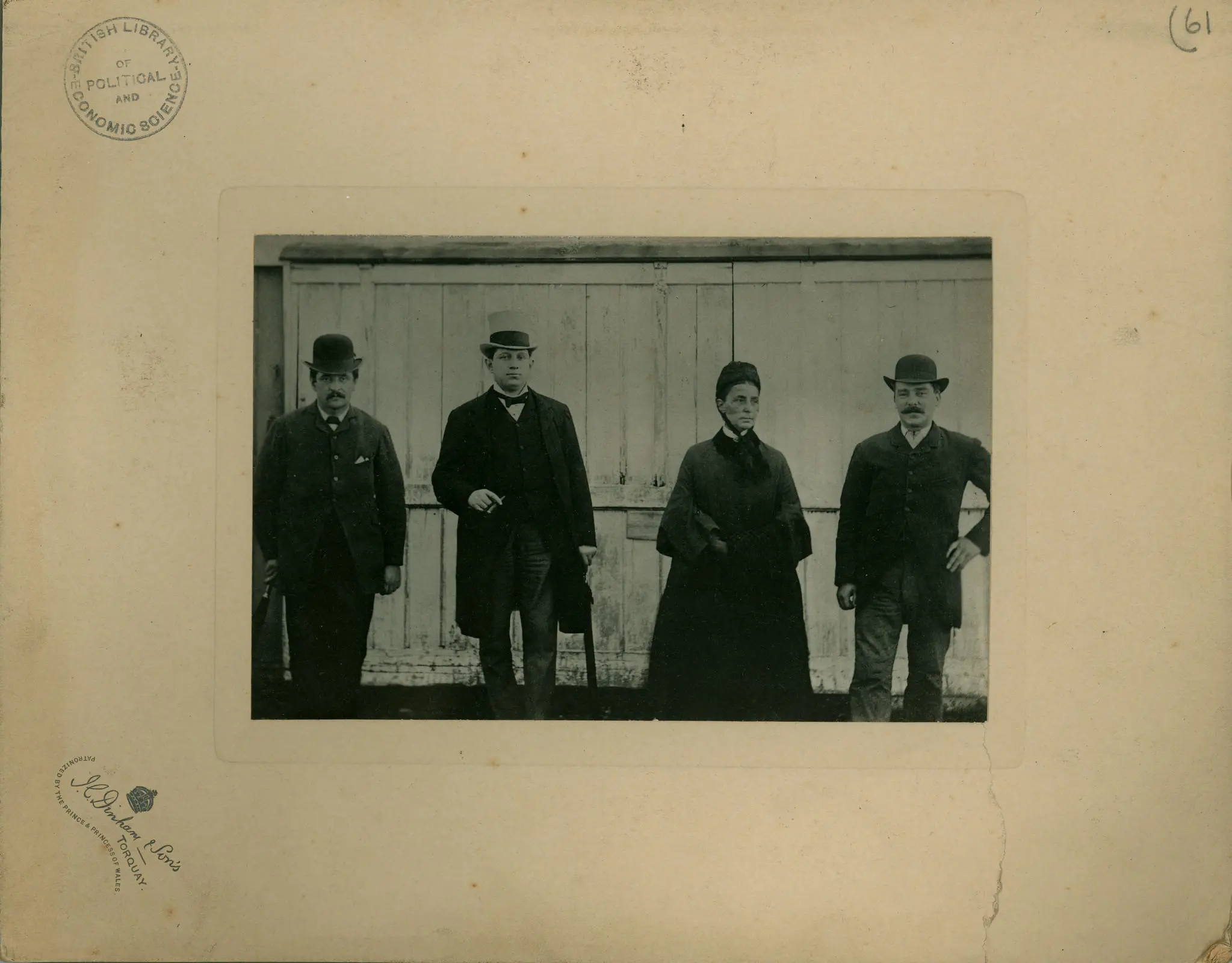 Four people stood in front of a building.