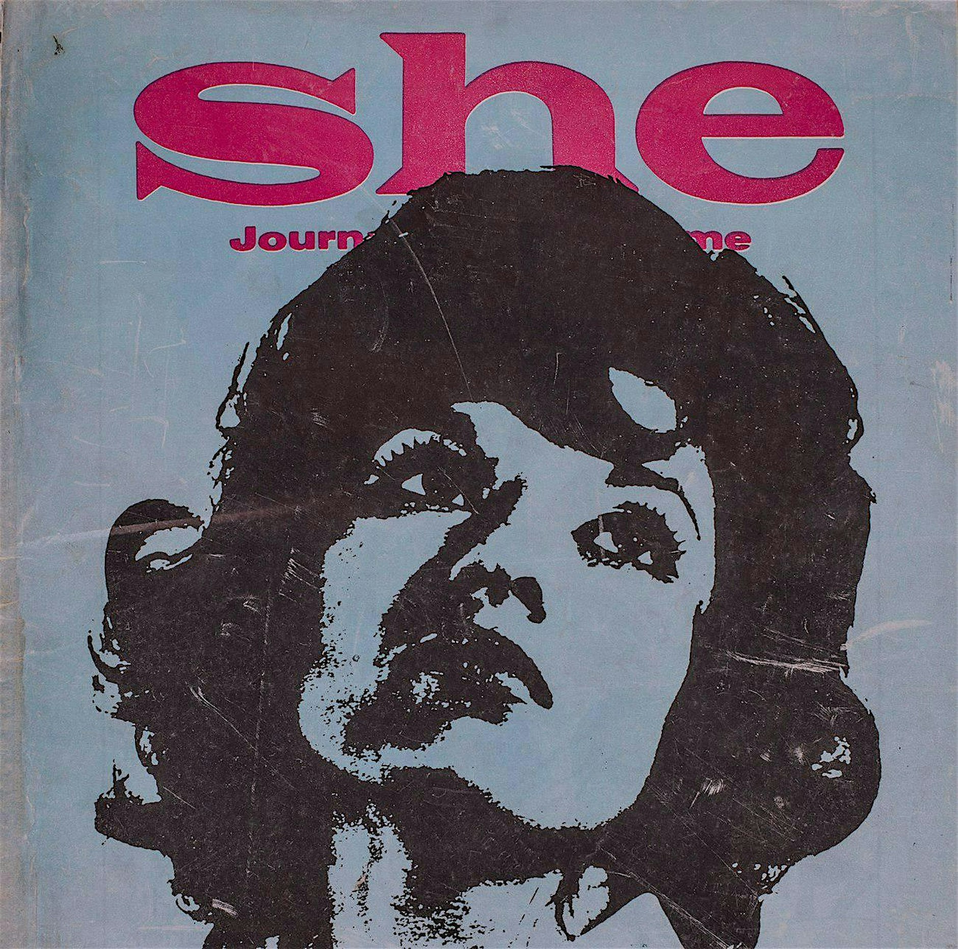 Front cover of She journal featuring a drawing of a woman's head.