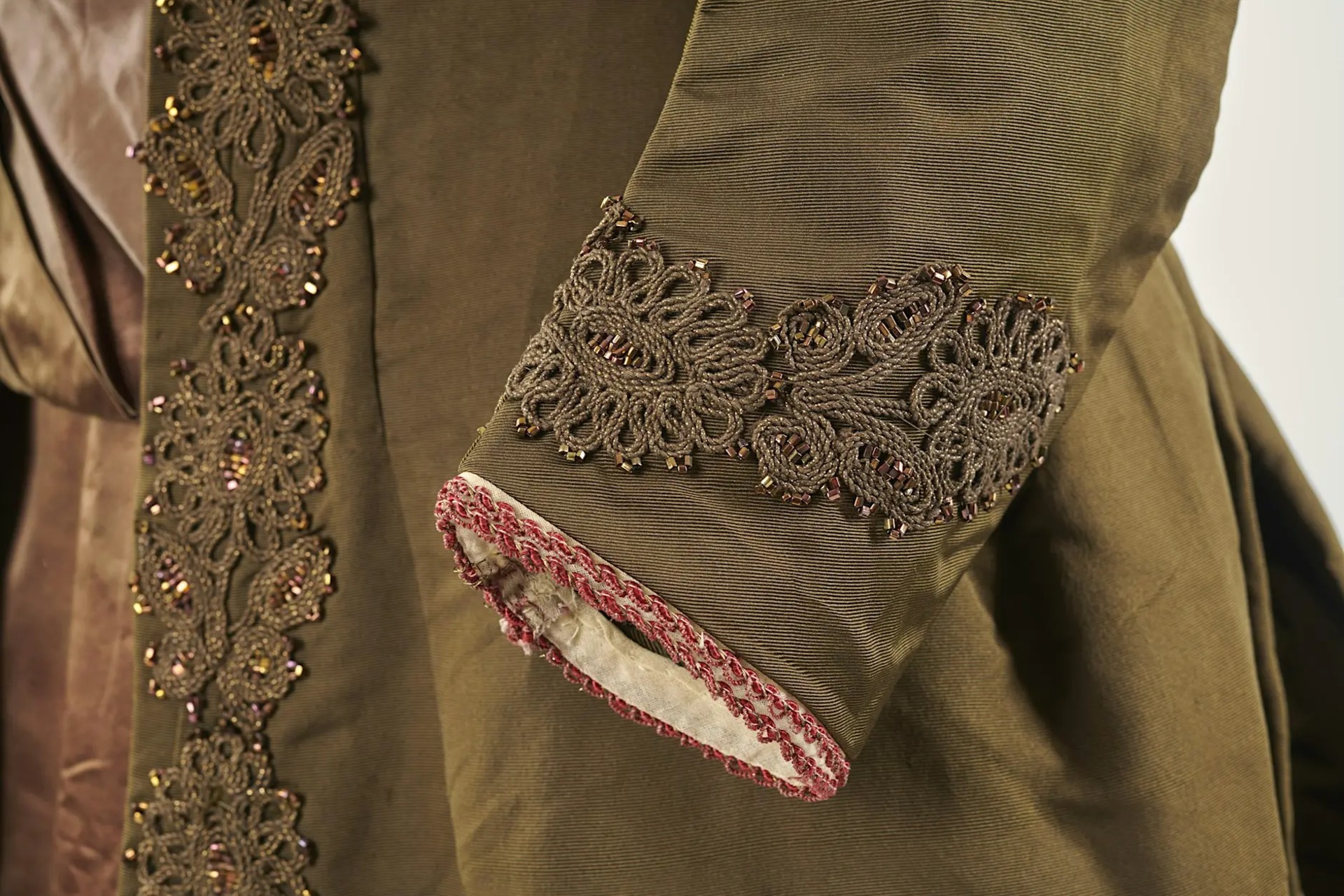 An intricate detail on the cuff of an outfit.