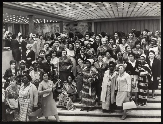 Delegates at the World Congress of Women, Moscow, Jun 1963, standing rows, on stairs in the lobby area of a building.
