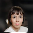 Headshot of woman with short brunette hair