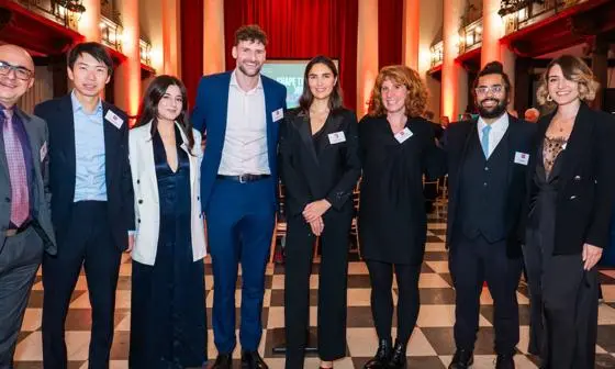 Group photo of Head of LSE Generate LJ Silverman with seven alumni who have signed the Entrepreneurs Pledge