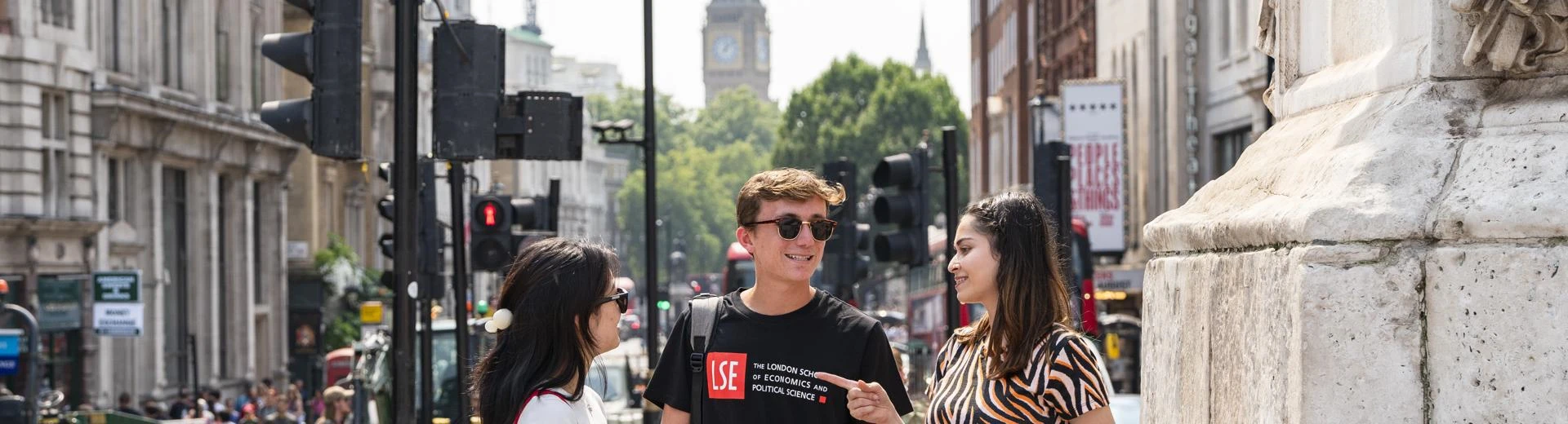 LSE students talking with Big Ben in the background