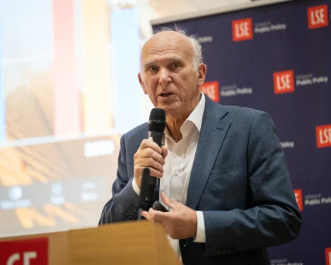 Sir Vince Cable presenting at a public event