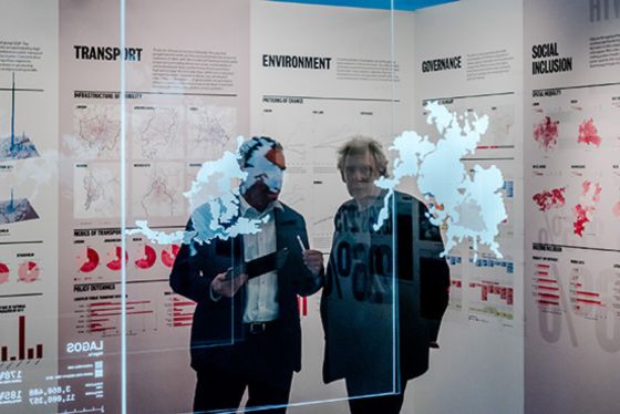 Ricky Burdett looks at a map in an LSE Cities exhibition